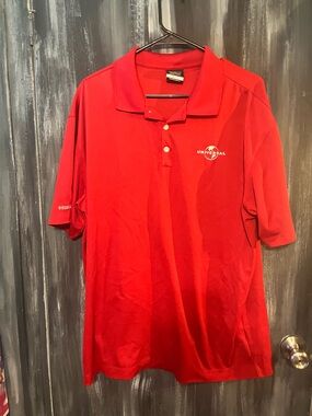 Nike Red Dri-FIT Golf Polo with Universal on it